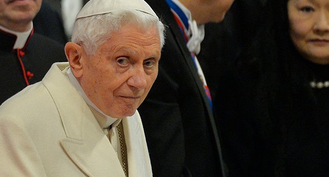 Pope benedict wearing a traditional white church outfit
