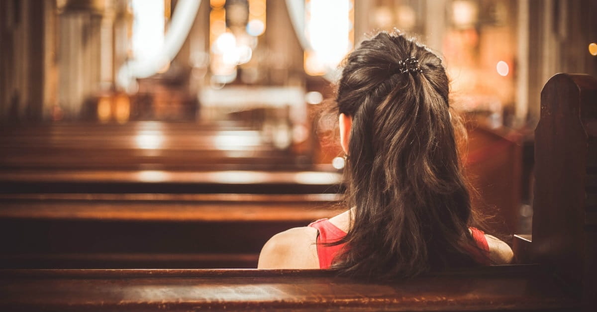 A woman sitting in a church