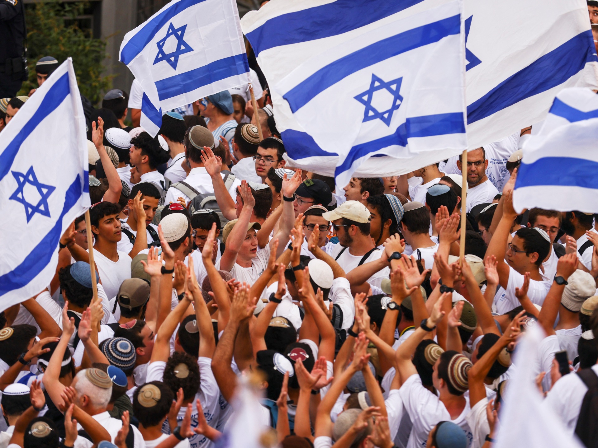 People holding flags of Israel