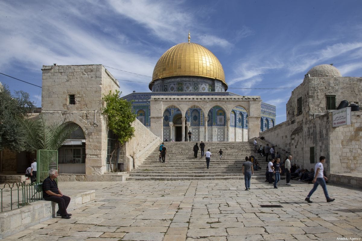 Muslims walk towards the Kubbet’us-Sahra (Dome of the Rock) as they arrive to perform the Friday Prayer at Al-Aqsa Mosque Compound in Jerusalem.