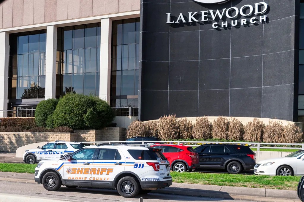 Police vehicles parked in front of the Lakewood church